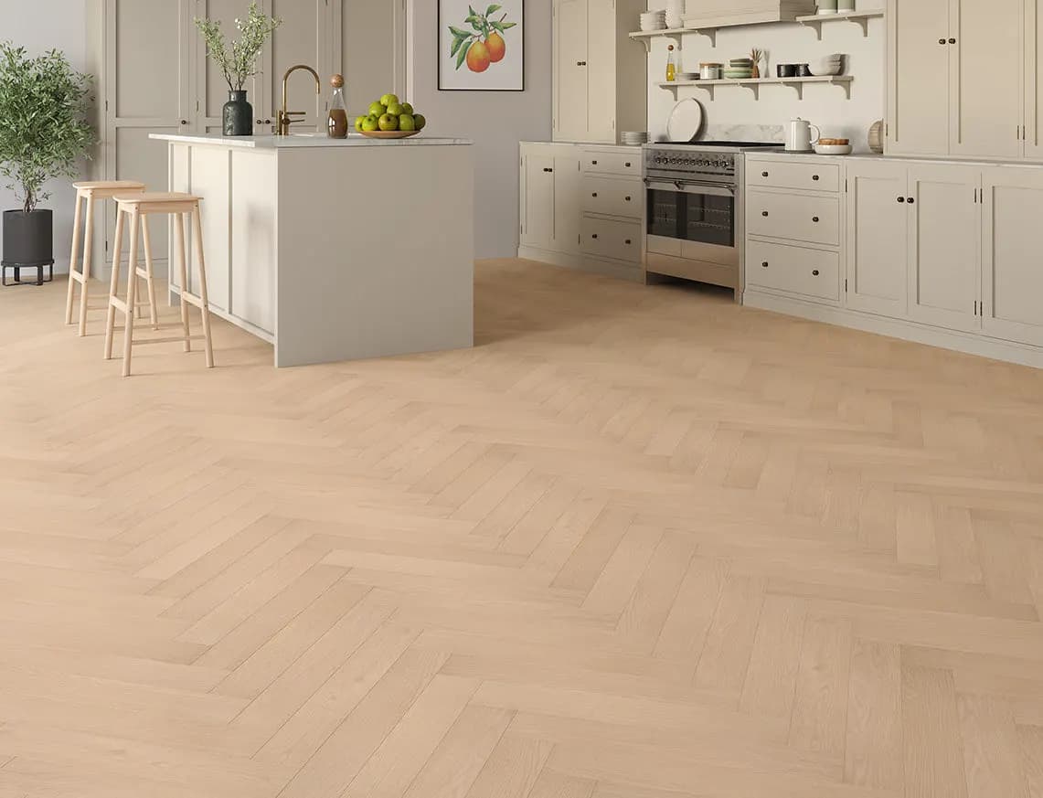 Oakleigh Deluxe 12mm Herringbone Kingham Laminate laid in a room
