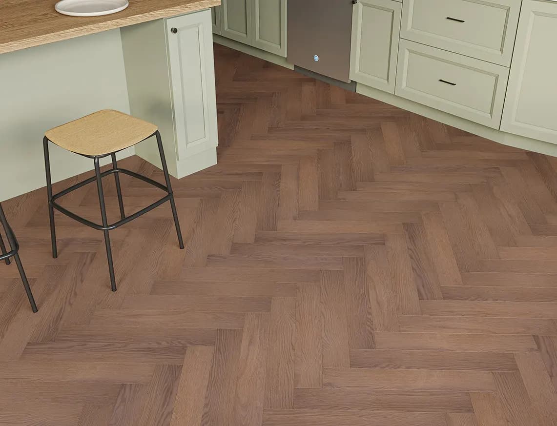 Oakleigh Deluxe 12mm Herringbone Romsey Laminate in a room